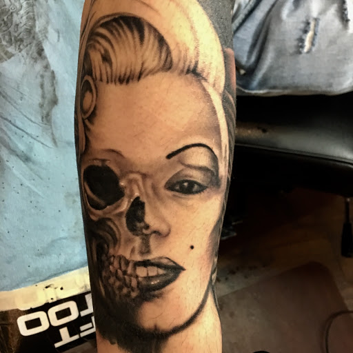 Explore grease tattoo ideas, creative tattoo ideas in Kingsford, available at Deft Tattoo Studio