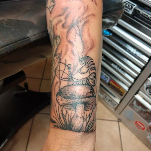 Explore alice in wonderland tattoo ideas, creative tattoo ideas in Rapid City, available at Convicted Designs Tattoo & Piercing