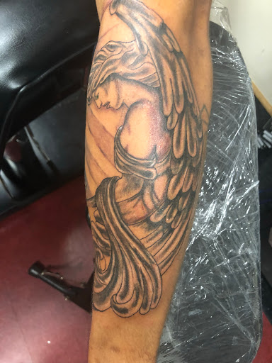 Explore strong woman tattoo ideas, creative tattoo ideas in Charlottesville, available at Mystic Tattoo and Body Piercing