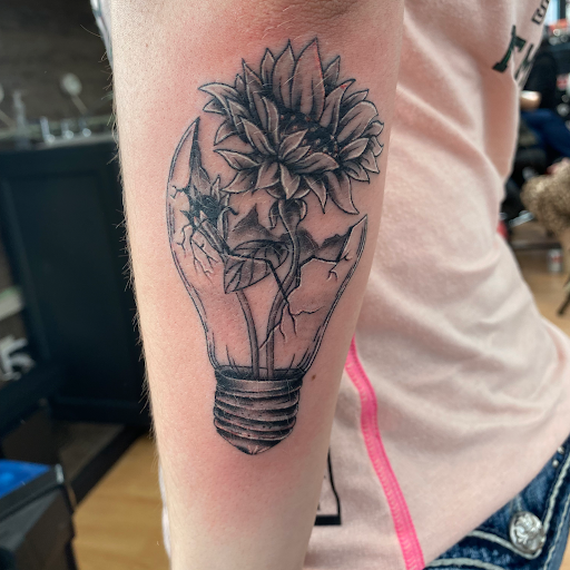 Explore lung cancer ribbon tattoo ideas, creative tattoo ideas in Durango, available at Heathen Tattoo