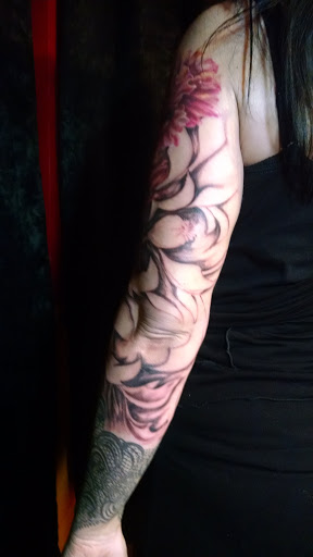 Explore black male tattoo ideas, creative tattoo ideas in Greenfield, available at Pygmalions Tattoo