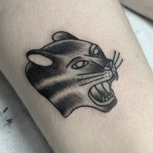 Explore tattoo ideas of strength, creative tattoo ideas in Edgewood, available at Wild Coyote Tattoo