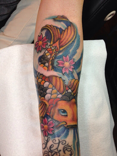 Explore tattoo ideas with flowers and names, creative tattoo ideas in Mandeville, available at Turning Point Tattoos