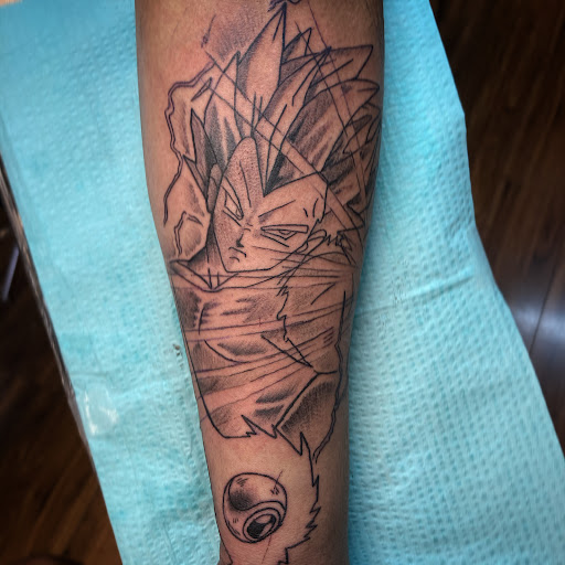 Explore joker hand tattoo ideas, creative tattoo ideas in Austin, available at Nexus Roze Tattoo Studio