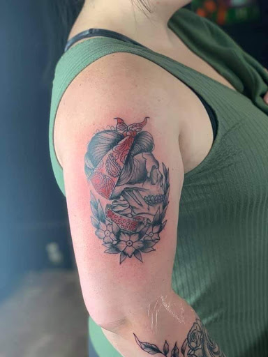 Explore motocross tattoo ideas, creative tattoo ideas in Sunbury, available at Knuckles & Needles Tattoo Parlor