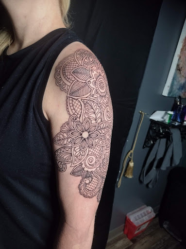 Explore rose tattoo ideas for females, creative tattoo ideas in Oelwein, available at Purple Thistle Tattoo