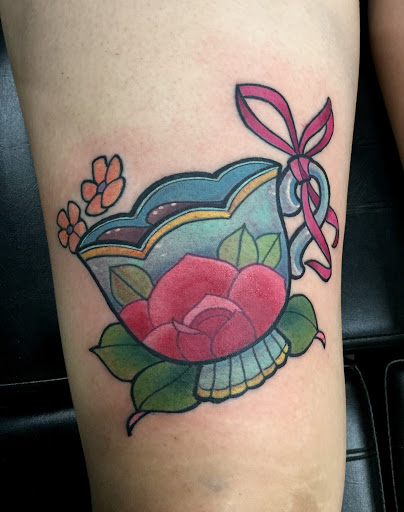 Explore tattoo ideas on the thigh, creative tattoo ideas in Addison, available at Cat Tattoo