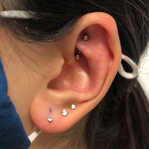 Explore weightlifting tattoo ideas, creative tattoo ideas in West Chester, available at Piercing by Jacqueline at X-Treme Ink Tattoo