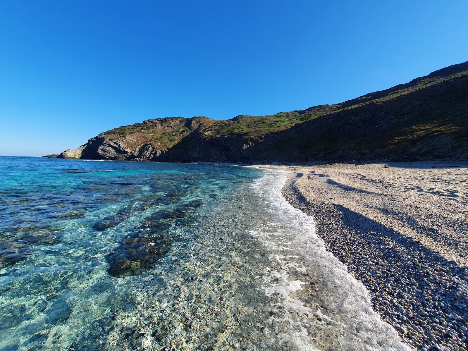 Fotografija Spiaggia Di Rena Majore podprto z obalami