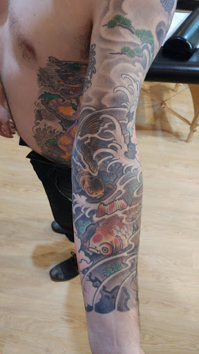 Explore shading ideas for sleeve tattoos, creative tattoo ideas in Covington, available at Illuminaut Tattoo