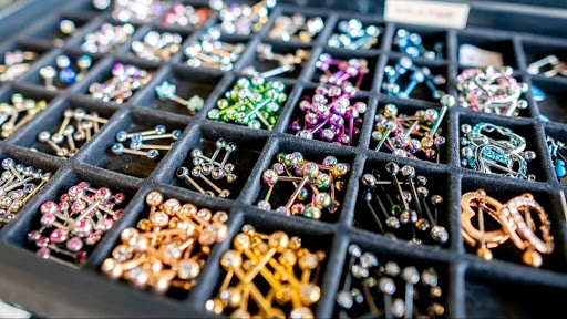 Explore male ankle tattoo ideas, creative tattoo ideas in Summerville, available at Exotic Impressions Body Piercing