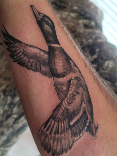 Explore ribbon tattoo ideas, creative tattoo ideas in Prescott, available at Geister Ink Tattoos