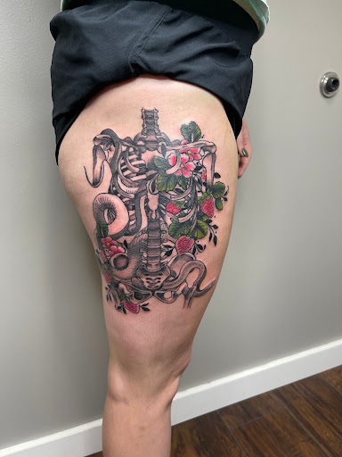 Explore loyalty over love tattoo ideas, creative tattoo ideas in Huxley, available at Lonely Bones Tattoo & Art