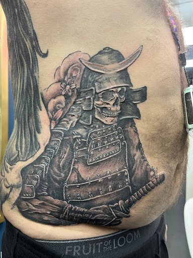 Explore horror half sleeve tattoo ideas, creative tattoo ideas in Grand Island, available at The Shaded Dahlia Piercing & Tattoo Parlor