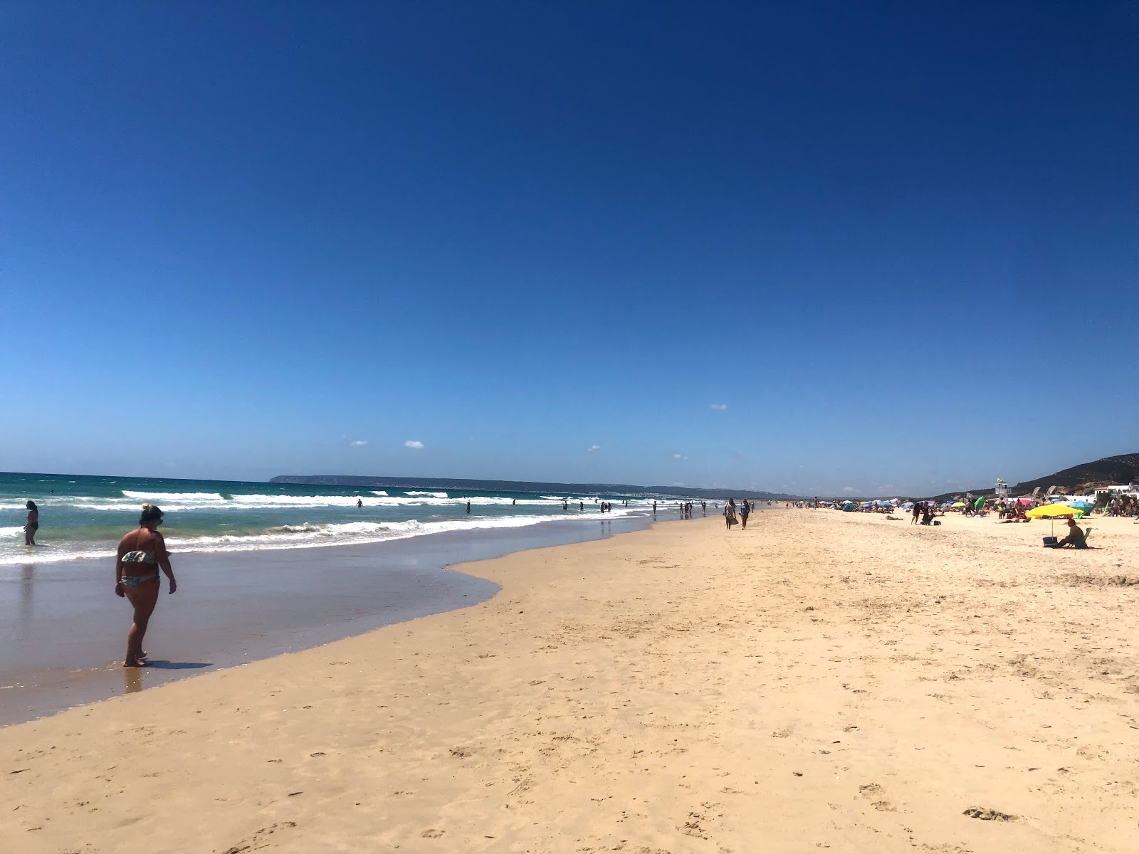 Foto von Playa del Cabo de la Plata und die siedlung