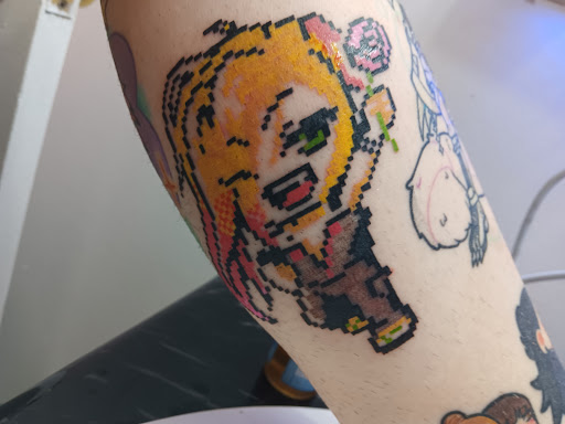 Explore knowledge tattoo ideas, creative tattoo ideas in Brooklyn, available at Cake Is a Lie Tattoo Parlor