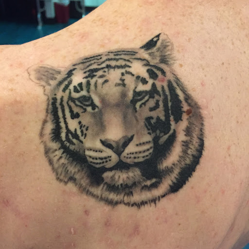 Explore trash polka tattoo ideas, creative tattoo ideas in Reno, available at Aces Tattoo