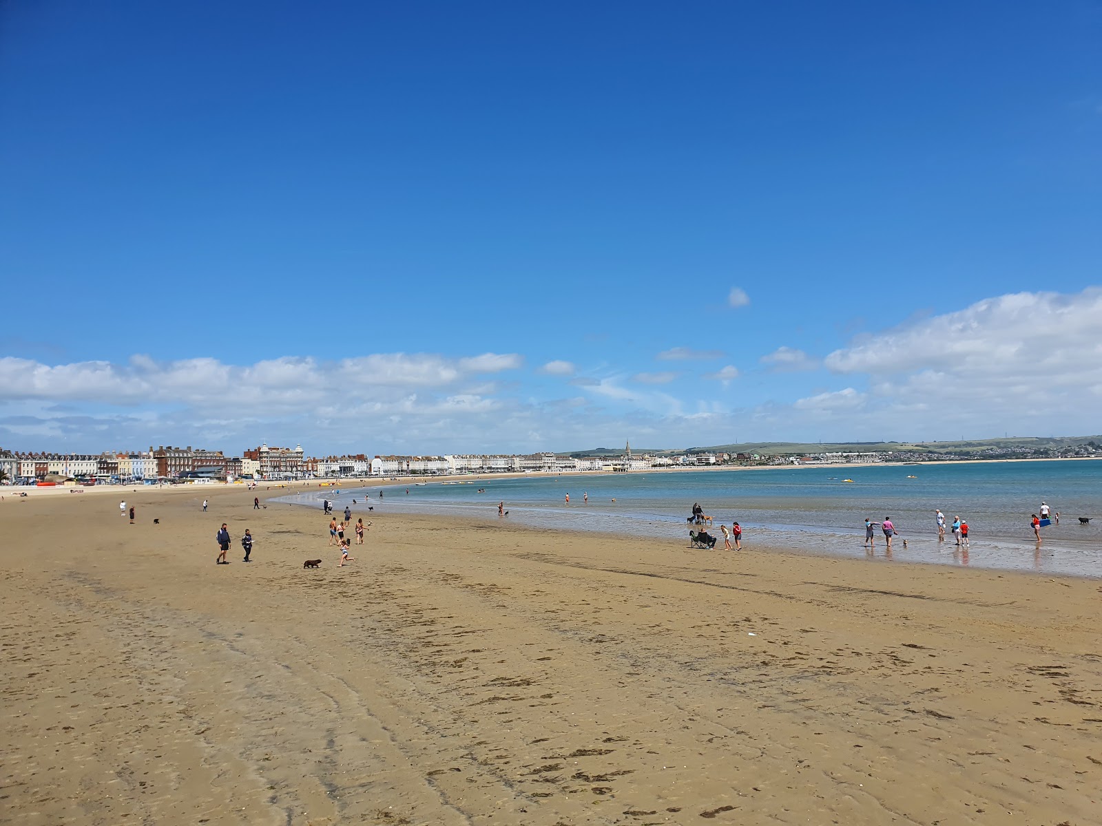 Foto av Weymouth Beach med blå rent vatten yta