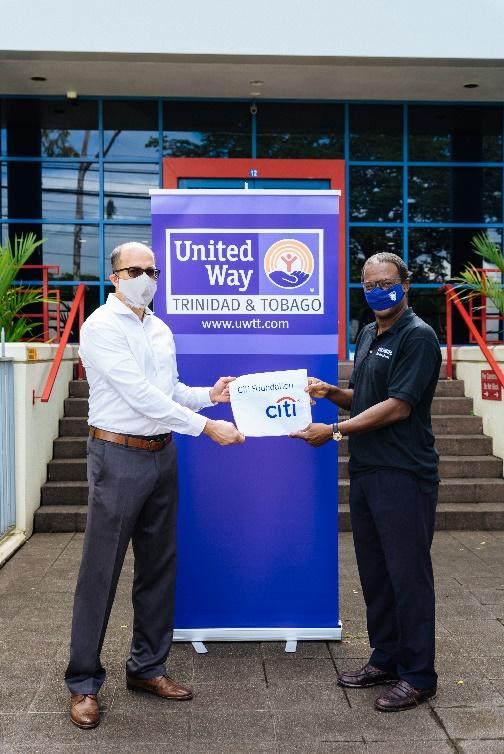 C:\Users\Kendall\AppData\Local\Microsoft\Windows\INetCache\Content.Word\Citibank Chief Country Officer Trinidad Mitchell De Silva hands over donation from Citi Foundation to UWTT Chair Ian Benjamin.jpg