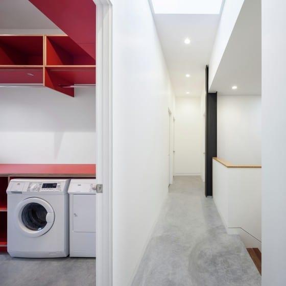 Laundry room and hallways of two-story house