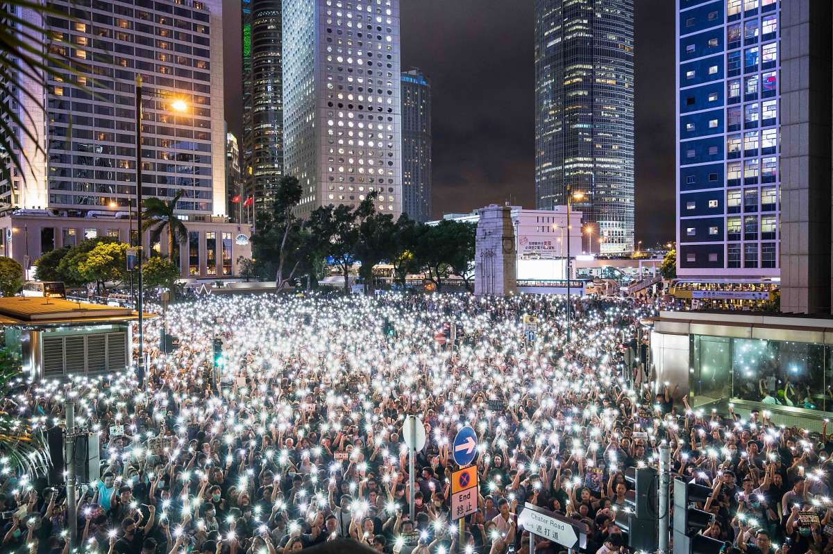 HONG KONG, CHINA - AUGUST 02: Demonstrators gather and illuminated smartphone flashlights during a rally organised by civil servants at Chater Garden in the Central district on Aug 02, 2019 in Hong Kong, China. Pro-democracy protesters have continued rallies on the streets of Hong Kong against a controversial extradition bill since 9 June as the city plunged into crisis after waves of demonstrations and several violent clashes. Hong Kong's Chief Executive Carrie Lam apologized for introducing the bill and declared it 