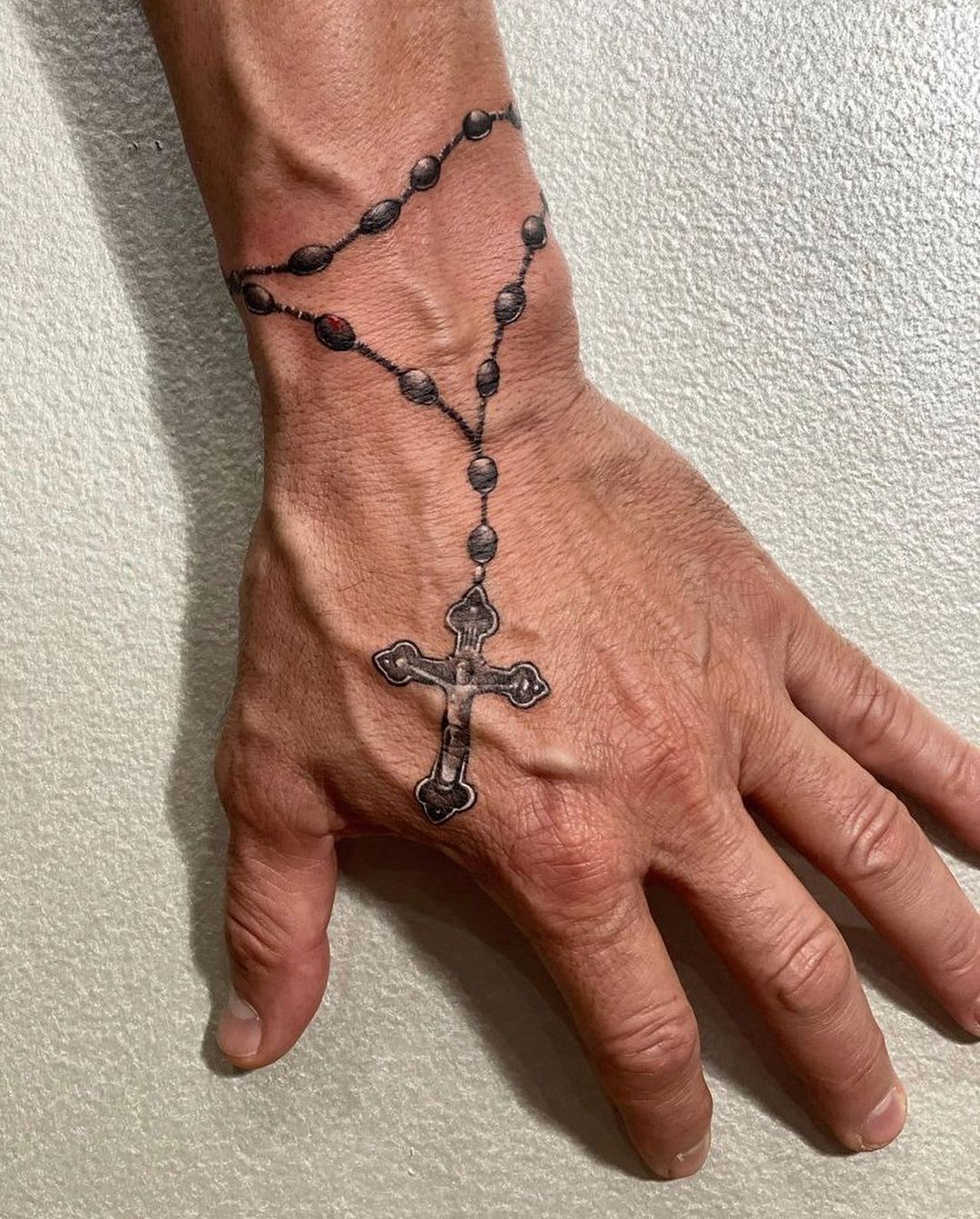 forearm rosary tattoo 