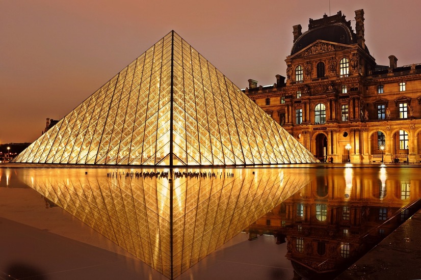 photo shows night view of the Louvre Pyramid