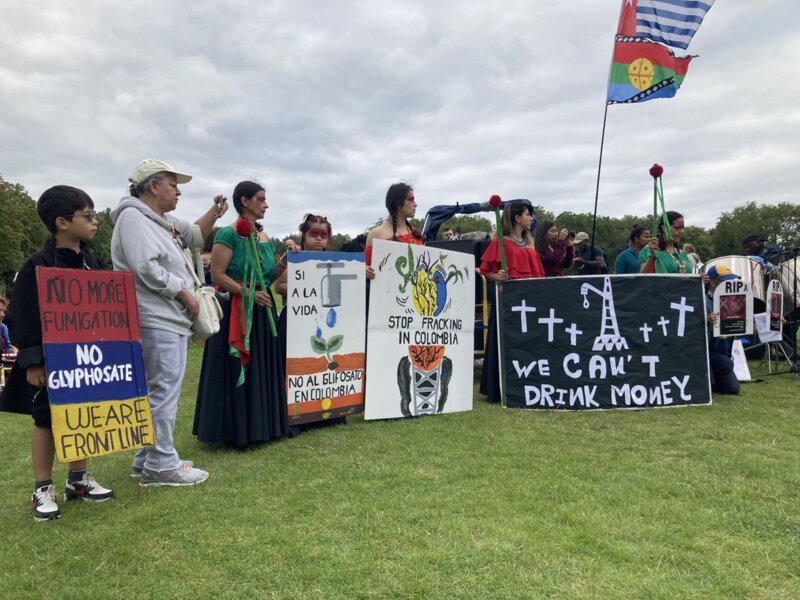 Indigenous people holding banners