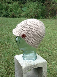 chunky cream crochet newsboy hat on mannequin