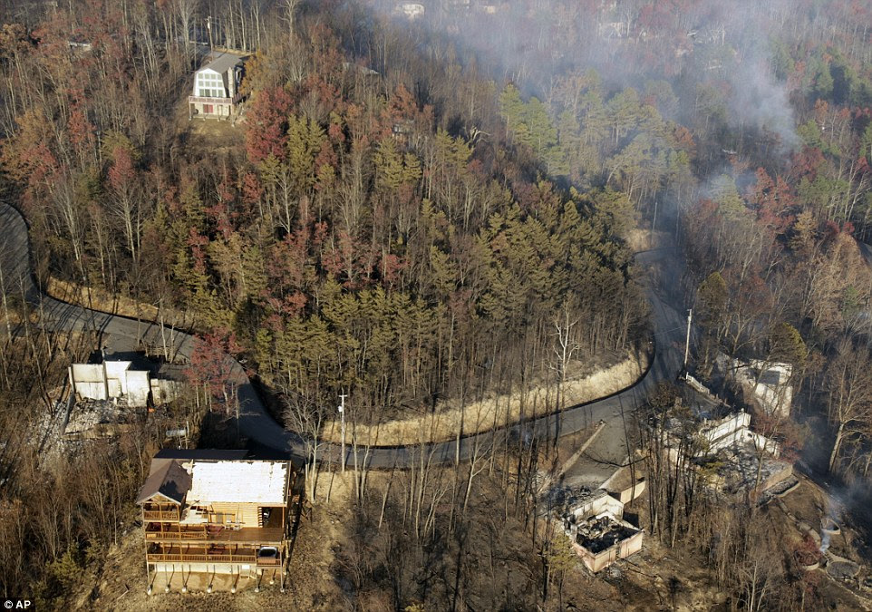 Destroyed buildings sit among burned trees near Gatlinburg, Tennessee on Tuesday after a wildfire swept through the area Monday