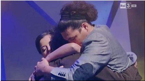 The loser Vargas is consoled by the contenders Nikola Savic and Raffaela Silvestri.