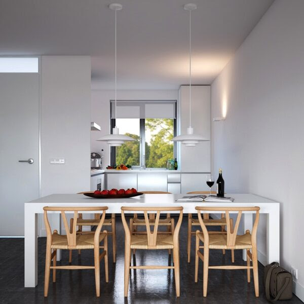 Subtly reminiscent of the first space, this apartment also indulges in an affinity with the industrially modern, which is often dictated by a designer’s approach to lighting. What diverts from a strictly industrial ethos with in this space, is an organic influence in styling: notice the way in which the light wood of the portrait frame and dining chairs compliment the heavily textured carpet, which again draws focus back to the industrial foundation of the space in its use of polished concrete.