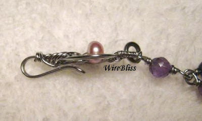 Wire wrapped Pipa Clasp with pearl side view of the Wire wrapped Pipa Clasp with pearl