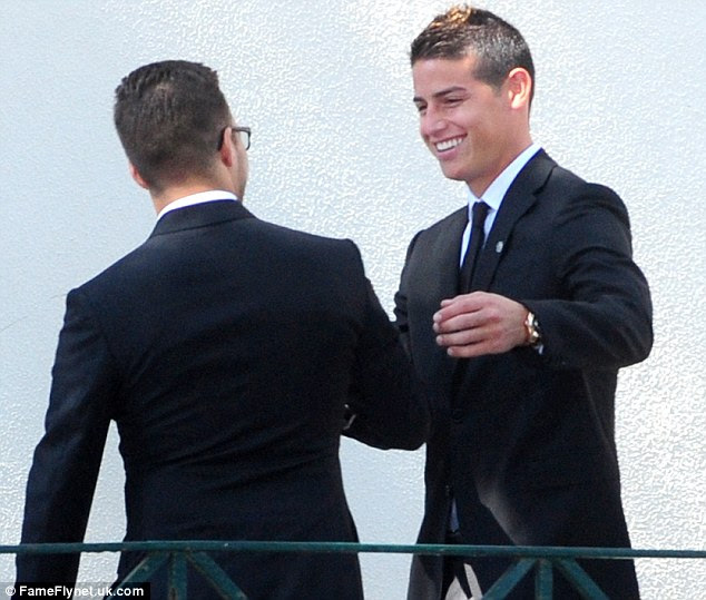 Real Madrid midfielder James Rodriguez meets a fellow guest at the wedding in Porto over the weekend
