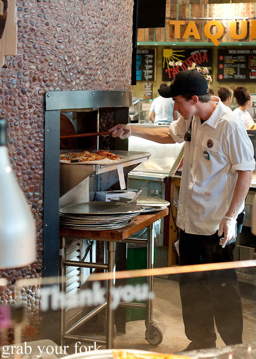 wood-fired pizza oven at whole foods market flagship store supermarket groceries austin texas