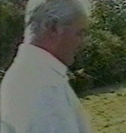 MISSING ABUSER No 1 This image of an unknown man watching other men having sex with the young girl was taken by Fred Lawlor. Photo: North Wales Police