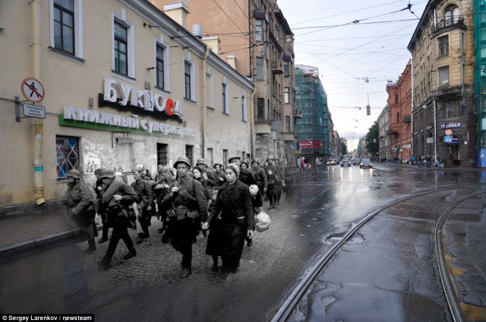 Juxtaposed: Soldiers marching in 1941 down a street in Leningrad - now St Petersburg in 2011