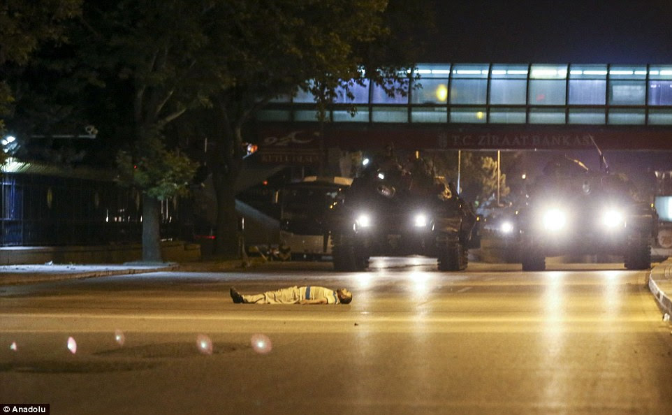 Civilians lay in the street in front of tanks to prevent them from rolling through Ankara as part of the ongoing military coup