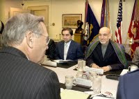 Afghan President Hamid Karzai (right) and Minister of Foreign Affairs Abdullah Abdullah (center) meet with Secretary of Defense Donald H. Rumsfeld (left foreground) in the Pentagon on June 14, 2004