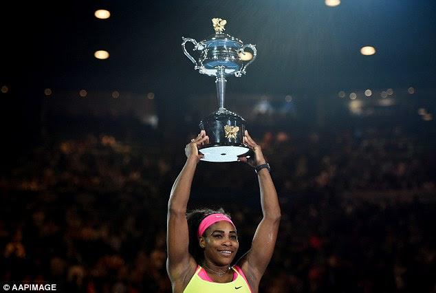 Williams holds aloft the trophy as she closes in Steffi Graf's record of 22 Grand Slam victories