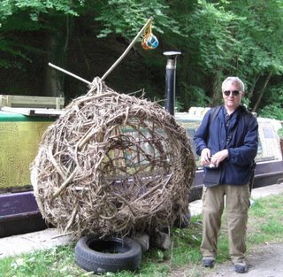 this ball woven of twigs is large enough to climb into and is for sale