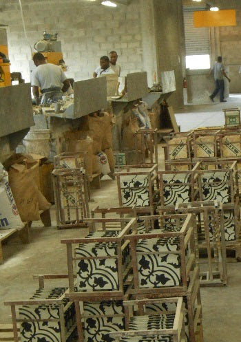 Cement tiles are placed on metal racks to dry after made Cement tiles are placed on metal racks to dry after made