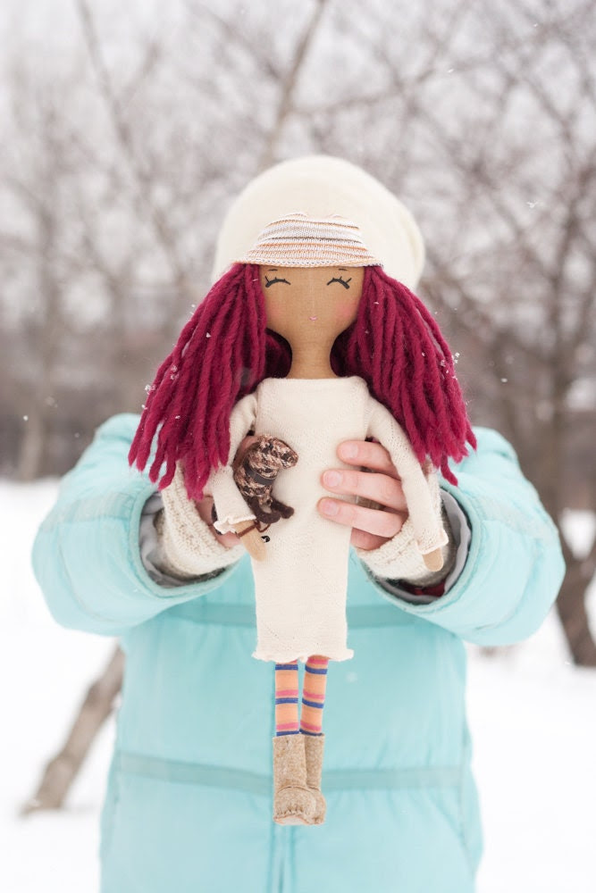 Red cloth doll and dog. Handmade fabric doll.
