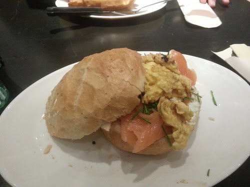 Smoked salmon and scrambled egg sandwich with sour cream and chives