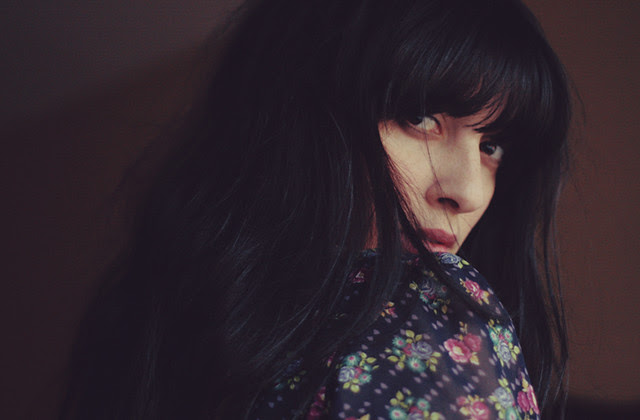 - there are flowers on her shoulders -