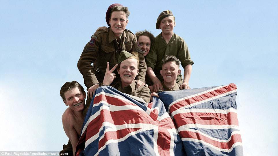 British Prisoners of War celebrate their liberation from Stalag 11B at Fallingbostel, in the German state of Lower Saxony on April  16, 1945. From left to right: Private Smyth of Downham, captured at Cherbourg in 1944; Private Ryan of Bradford, captured at Hertogenbosch, 1944; Corporal Beardmore of Cheadle, captured at Arnhem, 1944; Private Still of Manchester, captured at Arnhem, 1944 and Private Greare of Glasgow, captured at St. Valery, 1940