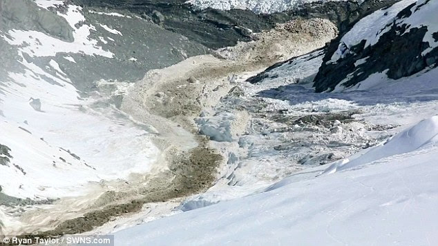 The thousands of tonnes of rock and ice flowing down the steep decline of the mountain look like a raging river