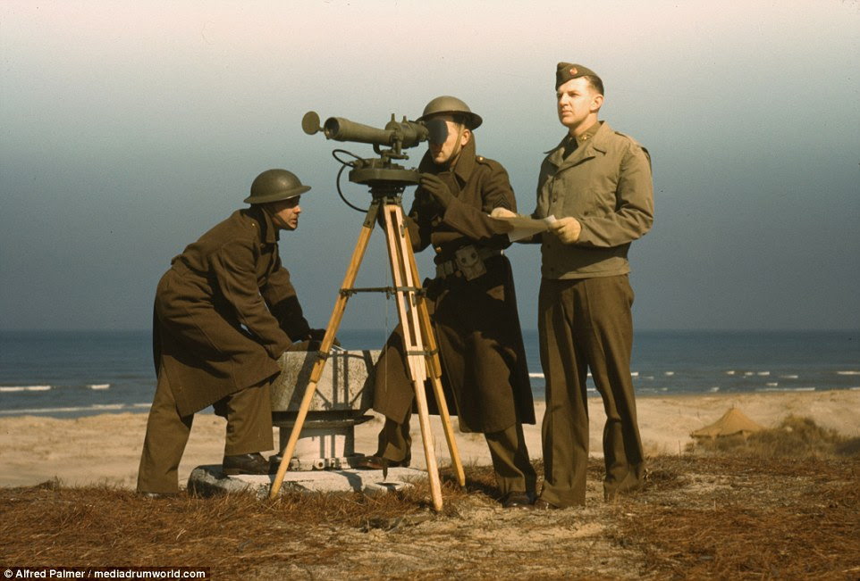 Men of Fort Story operate an azimuth instrument, to measure the angle of splash in sea-target practice, Fort Story, Virginia,