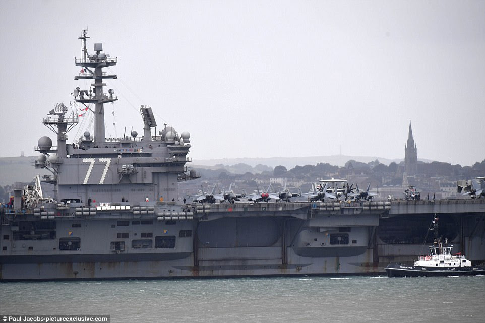 The 97,000-tonne USS George H. W. Bush aircraft carrier is 1,092 feet long and has a crew of over 5500 personnel, carries 80-plus combat aircraft on the 4.5-acre flight deck and towers 20 stories above the waterline