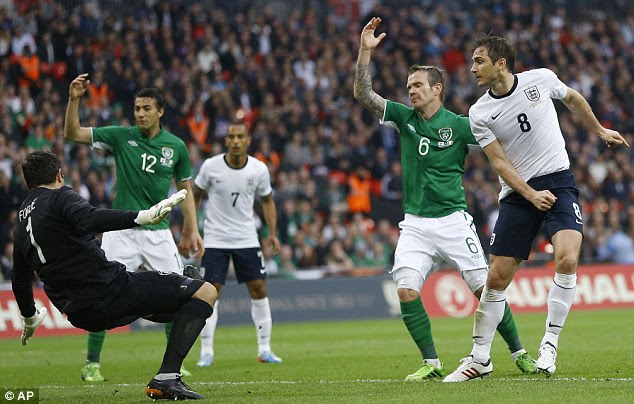 Level terms: Frank Lampard (right) pokes home the equaliser for England